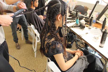 hot-ironing-braids-backstage-at-chris-benz-spring-2013